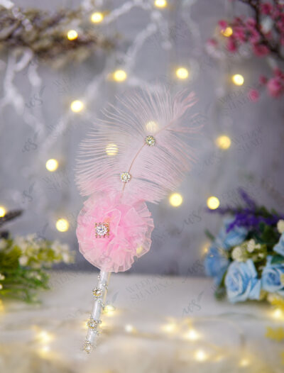 Side profile of the soft pink feather and crystal detailing for Nikkah signing