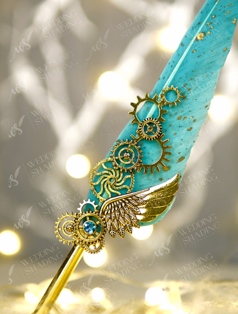 Beautiful golden metallic wing and steampunk gear details with blue gem