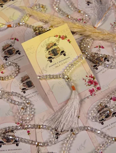 Close-up of floral vintage car design with clear prayer beads