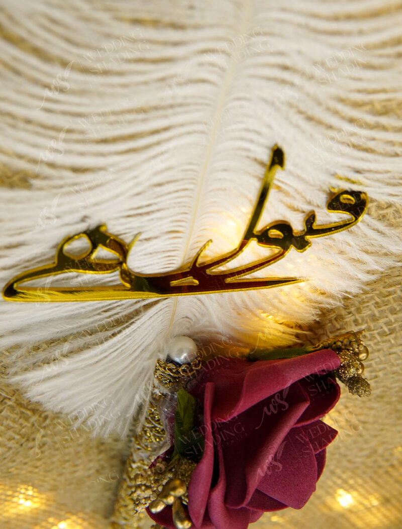 Small pearl accents and golden adornments highlighting the romantic rose