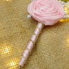 Elegant pink satin wrapped handle with spiraling rhinestone crystals