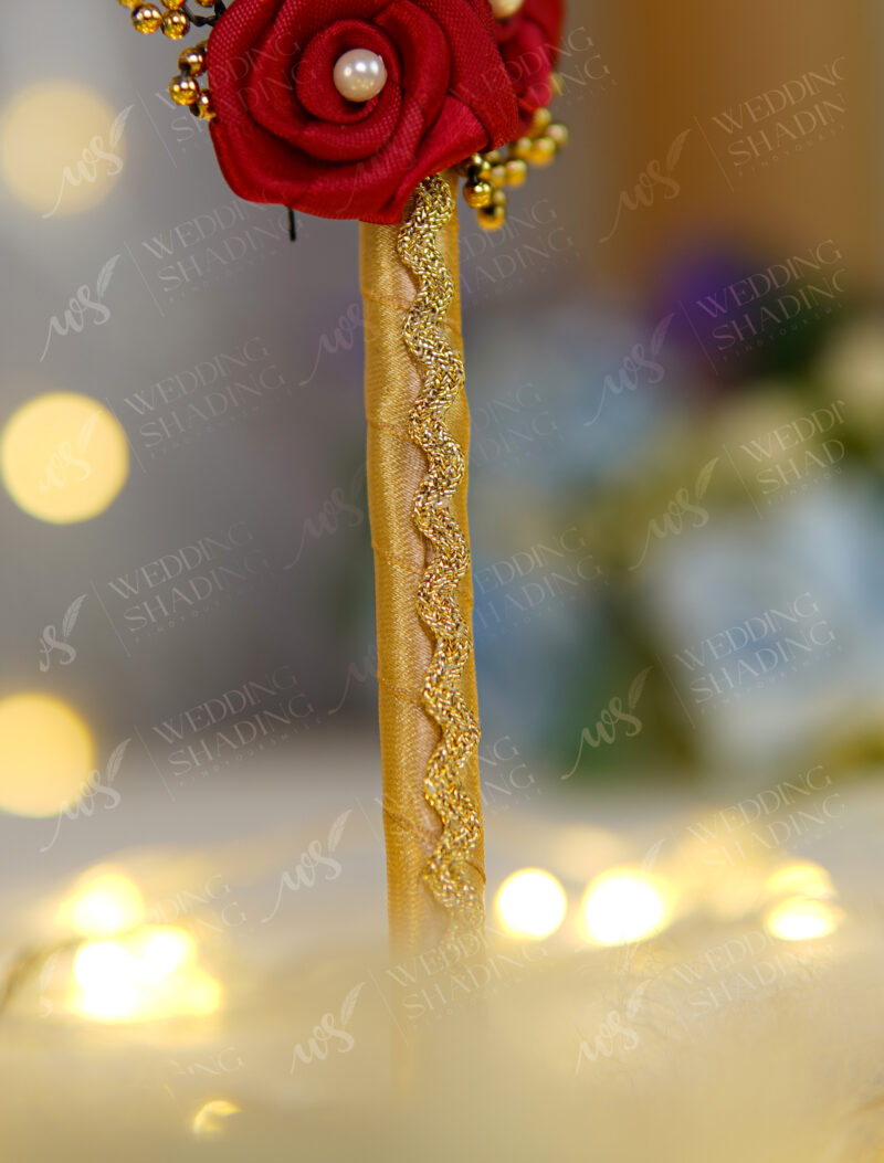 Deep red folded satin roses with pearls and golden calligraphy