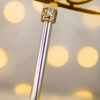 Close-up showing the gold glitter swirls and smooth silver handle