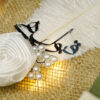 White satin handle spiraled with brilliant golden rhinestone chain