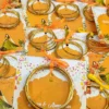 Close-up of dancing bride illustration on orange Mehndi card