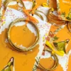 Multiple yellow bangle favour cards for Mayun celebrations