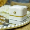 Close-up of pearl border on personalized round mirror Nikkah tray