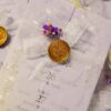 Multiple lavender wedding cards arranged showing vellum wraps