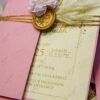 Pink pocket envelope Nikkah invitation with gold wax seal and dried flowers