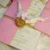 Close-up of dried baby's breath flower embellishment on invitation