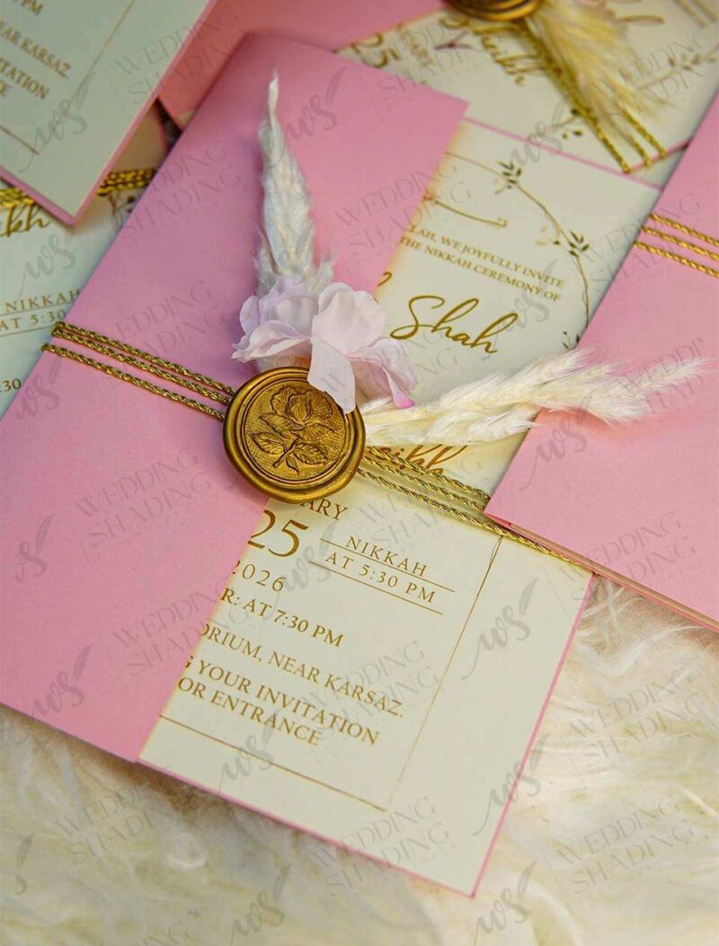 Close-up of dried baby's breath flower embellishment on invitation