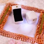 Pink pearl square ring tray with mirrored base and gold corner accents