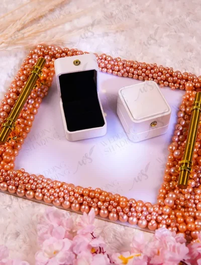 Pink pearl square ring tray with mirrored base and gold corner accents