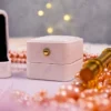 Close-up of clustered pink pearl border on square ring display tray