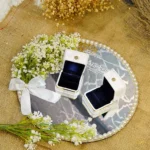 Rustic wood slice ring tray with laser-engraved names and dried flowers