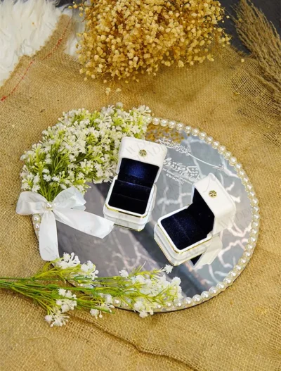 Rustic wood slice ring tray with laser-engraved names and dried flowers