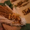 Dried pampas grass and eucalyptus detail on wooden ring tray