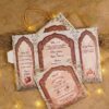 Multi-fold Mughal arch wedding invitation with red and gold panels