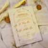 Overhead arrangement of multiple finished white wedding invitations